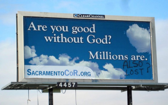 Vandalized billboard in Sacramento, CA.